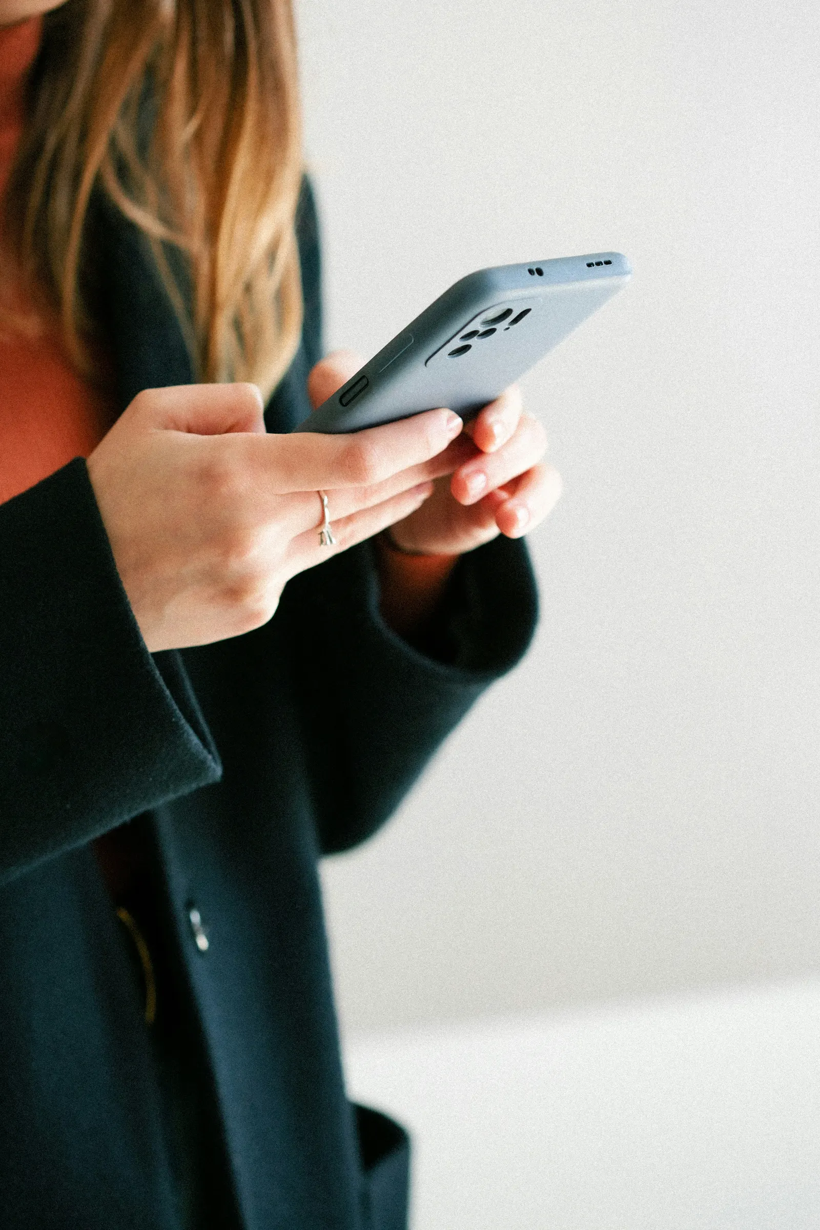 A home buyer texting a question from their phone